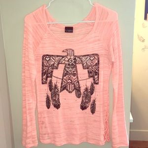 Peach sweater with Native American thunderbird